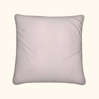 pink pillow on a black background