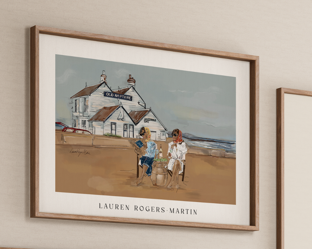 Framed artwork by Lauren Rogers Martin of people by a beach house.