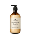 Brown bottle of 'Whitstable Beach' hand & body lotion with pump on a white background