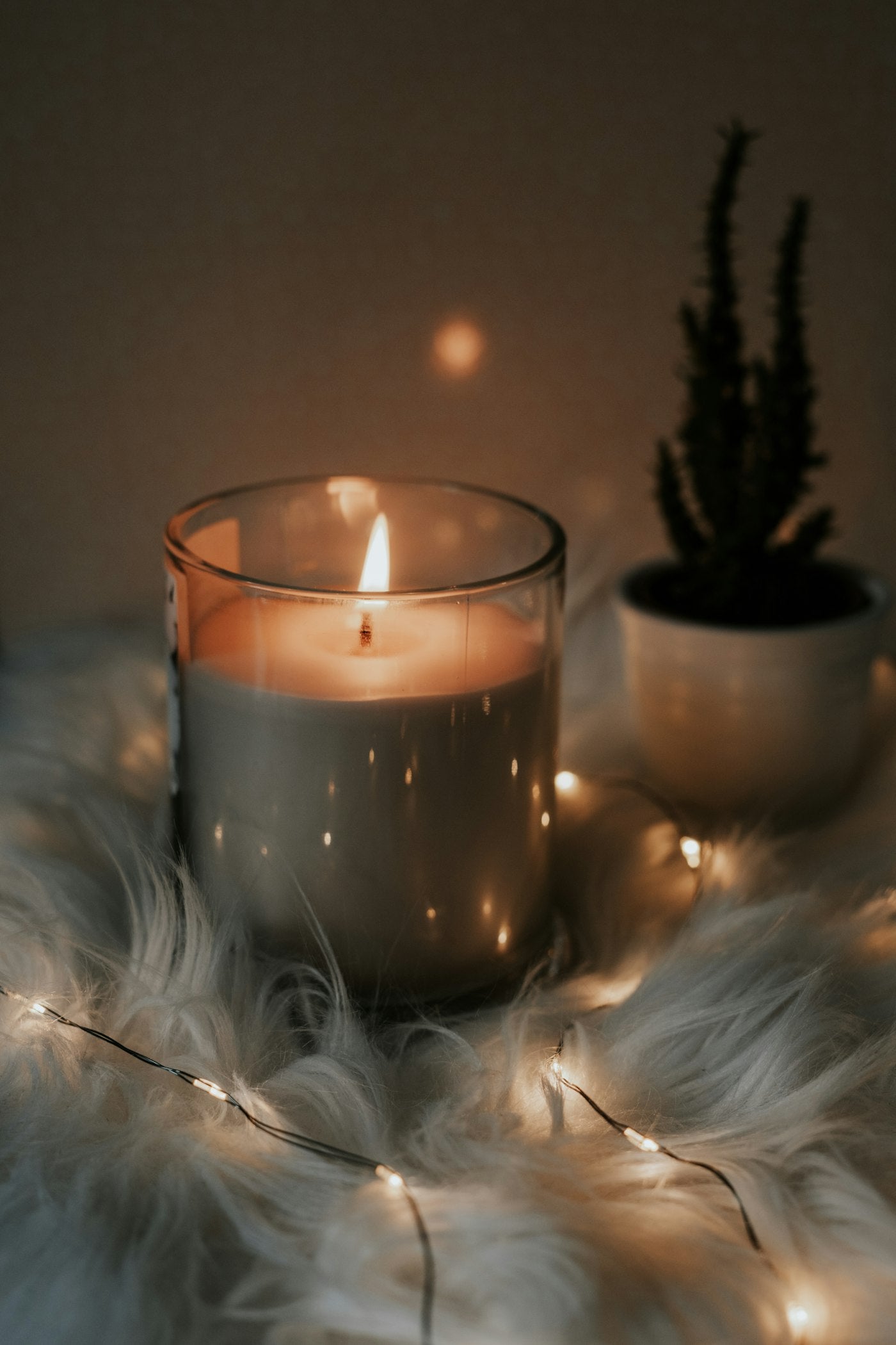 A lit candle, ritual styled